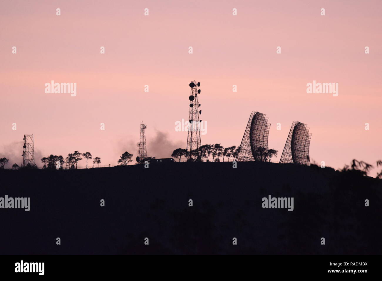 Communication and broadcasting equipment mounted on the summit of Mount Sto. Tomas in Tuba, Benguet, Philippines viewed from different locations. Stock Photo
