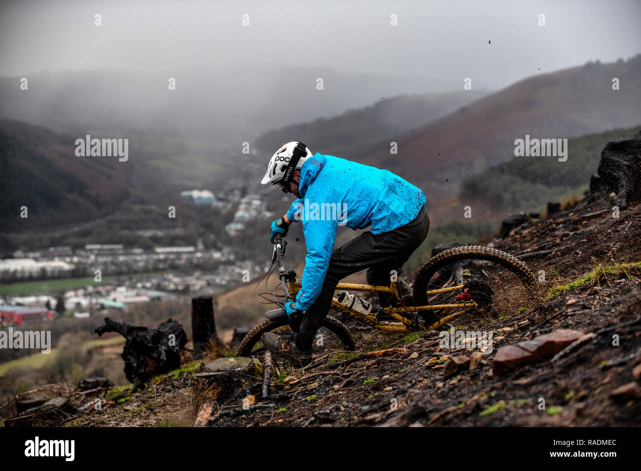 A mountain biker rides a trail above the town of Risca in South Wales. Stock Photo