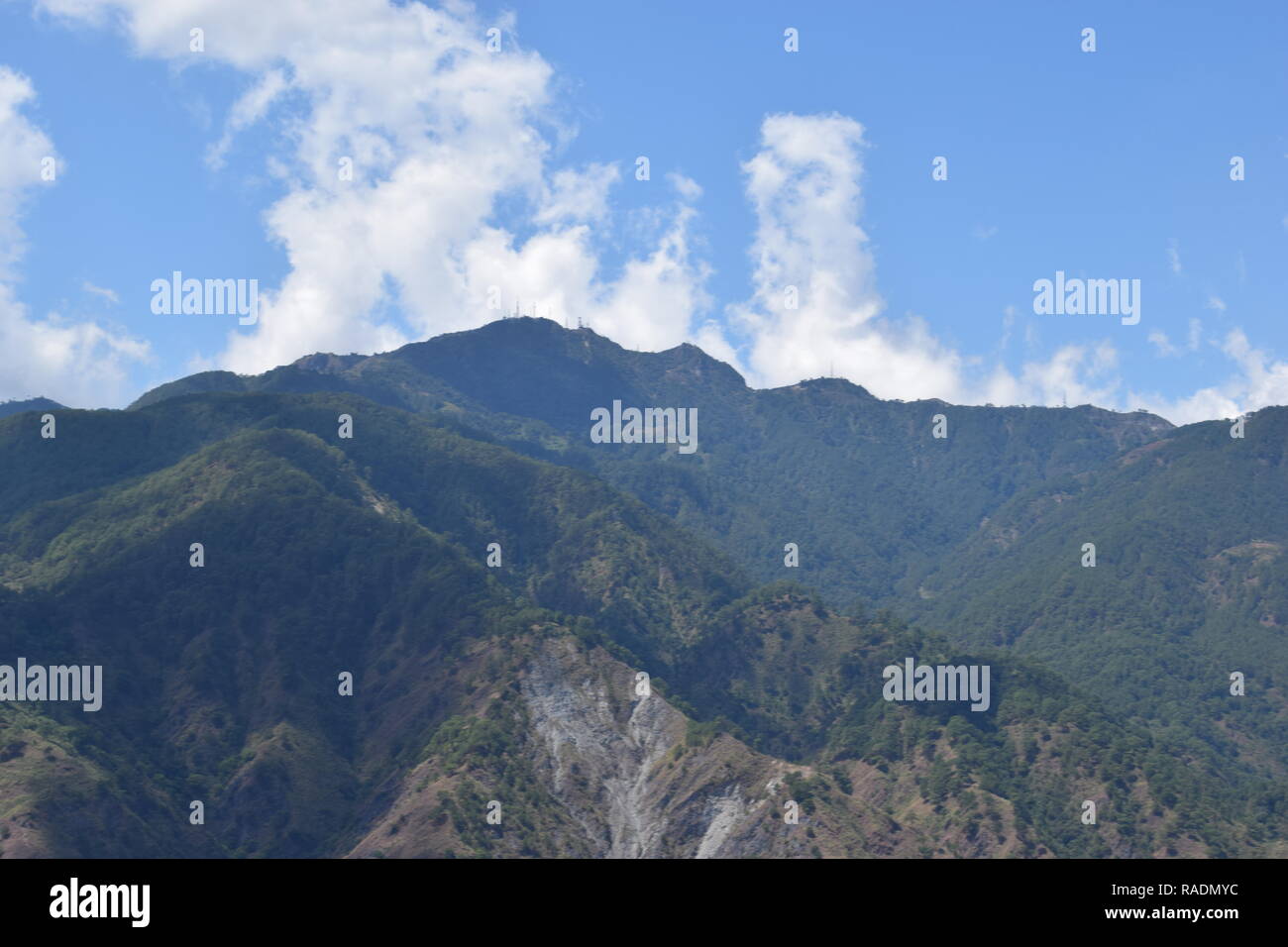 Communication and broadcasting equipment mounted on the summit of Mount Sto. Tomas in Tuba, Benguet, Philippines viewed from different locations. Stock Photo