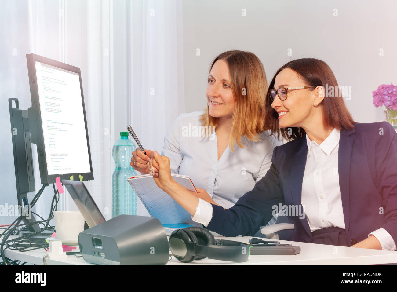 Two business women during meeting in the office Stock Photo - Alamy