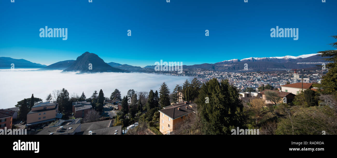 Thermal inversion on the Lugano Lake in Switzerland Stock Photo