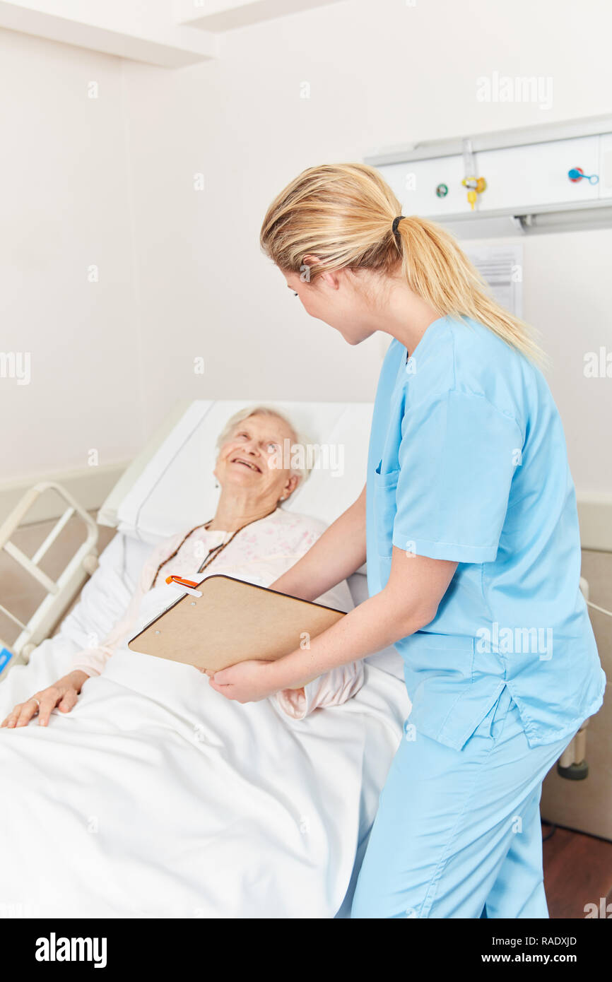 Old woman hospital bed nurse hires stock photography and images Alamy