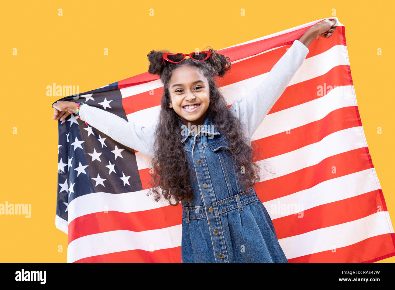Girl holding us flag hi-res stock photography and images - Alamy
