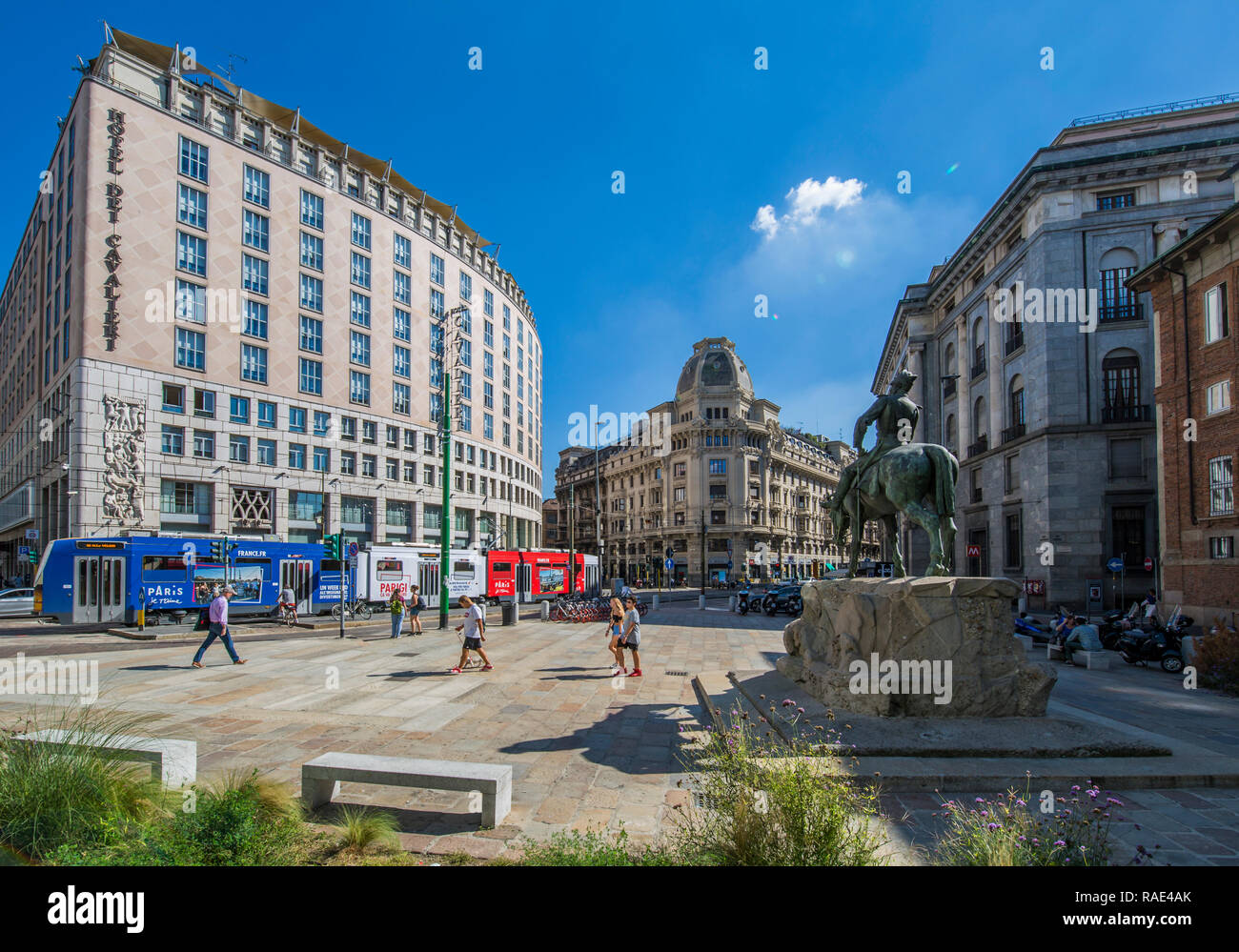 City tram and statue in Piazza Giuseppe Missori, Milan, Lombardy, Italy, Europe Stock Photo