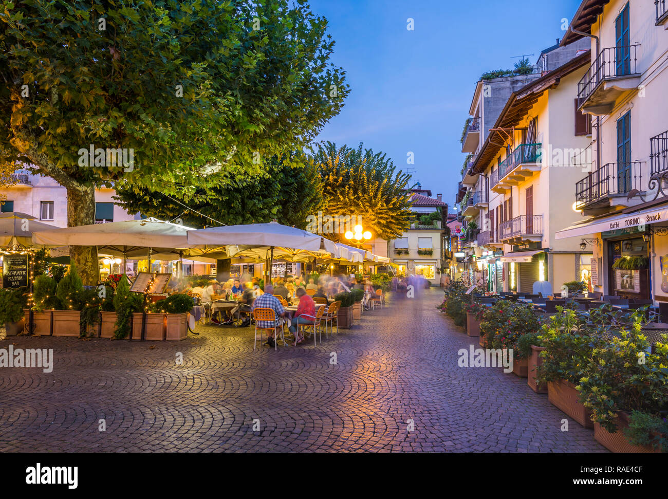 View of restaurants and souvenir shops in Stresa at dusk, Lago Maggiore, Piedmont, Italian Lakes, Italy, Europe Stock Photo