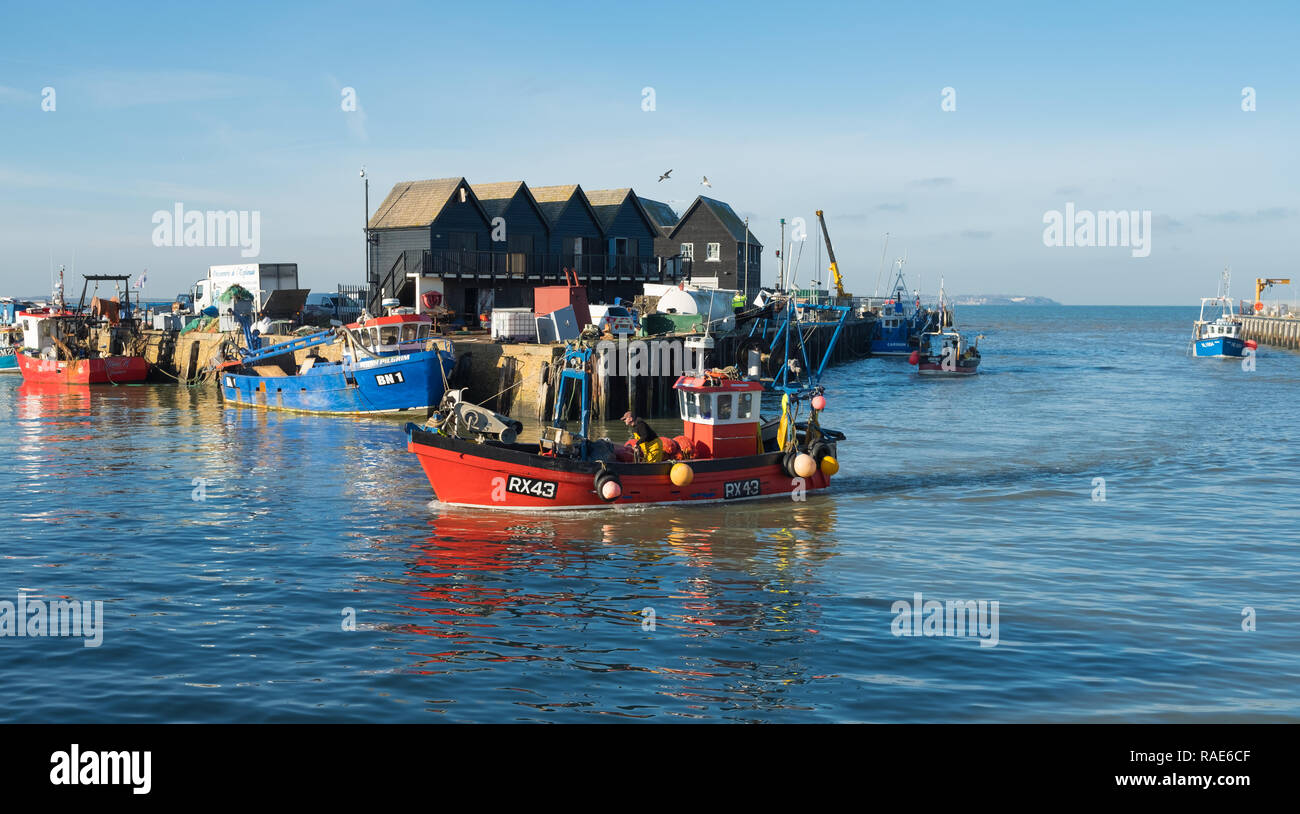 Fishing boats returning to harbour, Whitstable Harbour, Kent Stock Photo