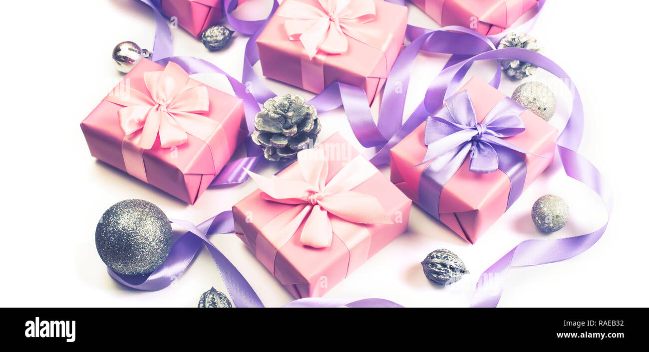 Banner Christmas boxes with gifts on the occasion of pink color on