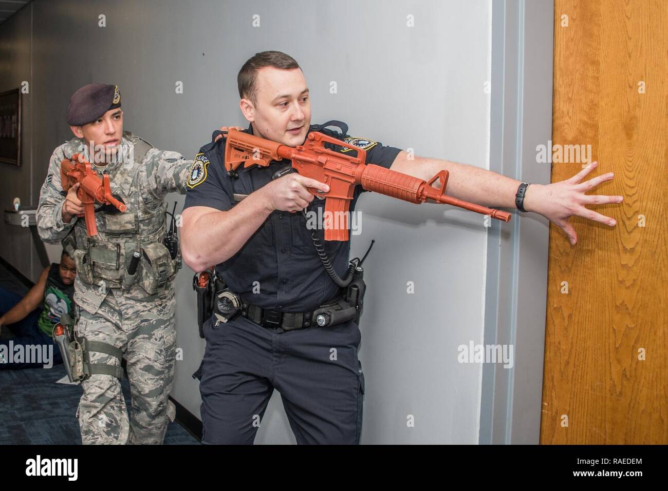 Maxwell AFB, AL - 42d Security Forces Squadron personnel simulate responding to a report of an active shooter during a base exercise, Jan. 23, 2017. Stock Photo