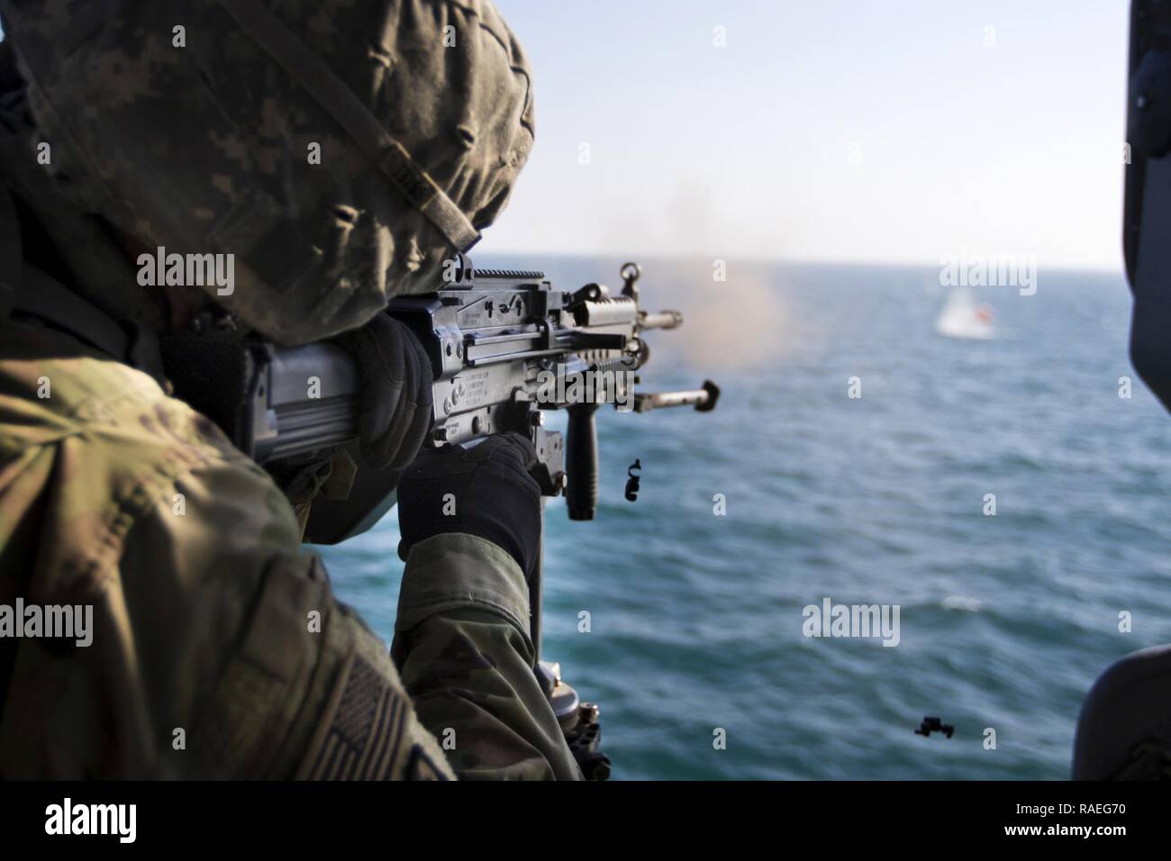 A U.S. Army Soldier, with the 411th Transportation Detachment, fires ...