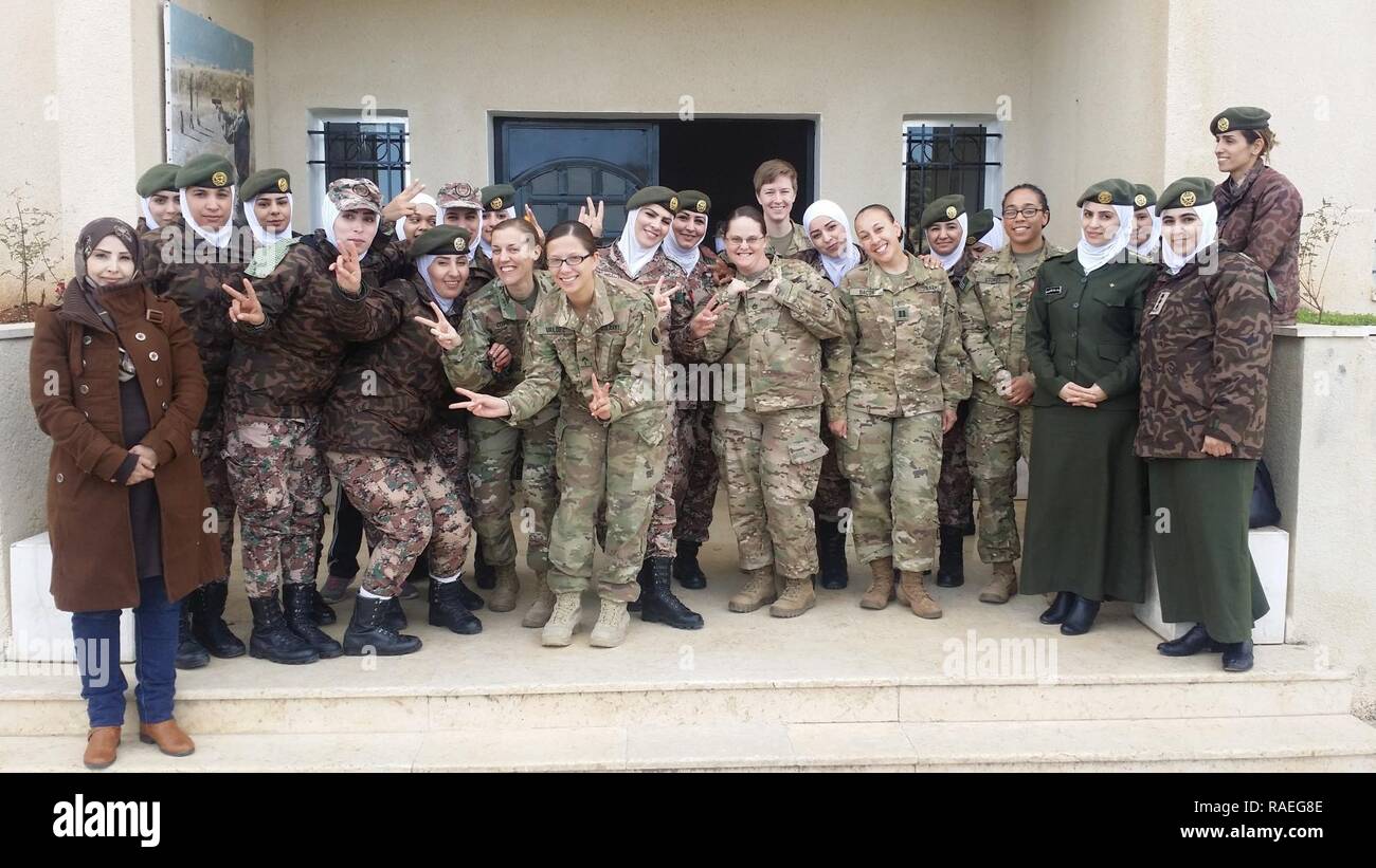 Female Maryland and Virginia National Guard Soldiers from the 29th Infantry Division pose with female soldiers from the Jordan Armed Forces- Arab Army Female Company For Special Security Tasks during an engagement Jan. 17, 2017, near Amman, Jordan. While in Jordan from September 2016- July 2017, Soldiers of Task Force 29 planned and coordinated multiple engagements with JAF female soldiers, providing both U.S. and Jordanian military women the opportunity to exchange information and best practices on leadership, communications skills and various women's empowerment topics. Stock Photo