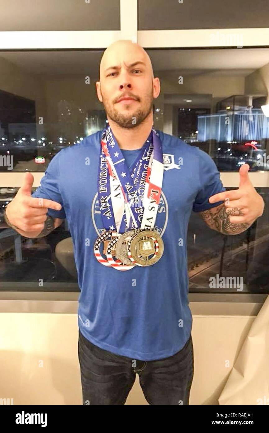 U.S. Air Force Tech. Sgt. Derrall Peach, 355th Logistics Readiness Squadron ground transportation craftsman, poses with his winning medals from the 2018 Air Force Wounded Warrior Trials at Nellis Air Force Base, Nev. Feb. 23-March 2, 2018. Peach, along with 39 other athletes, qualified to compete in the Department of Defense Warrior Games in various sports. Stock Photo