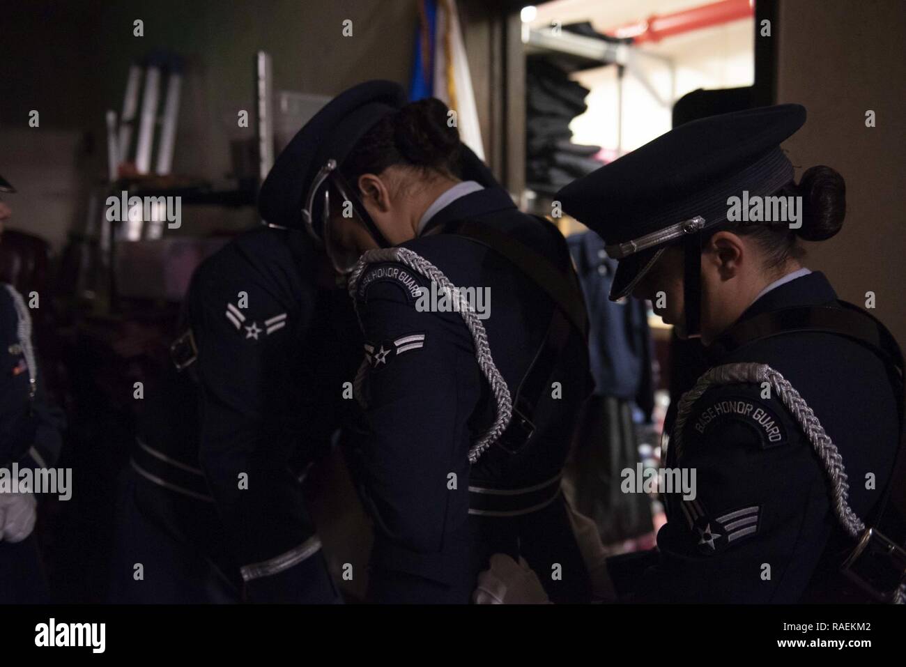 U.S. Air Force Airmen with the 18th Wing Base Honor Guard adjust their