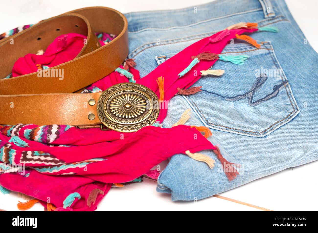 accessories on a white background scarf, belt, jeans Stock Photo Alamy