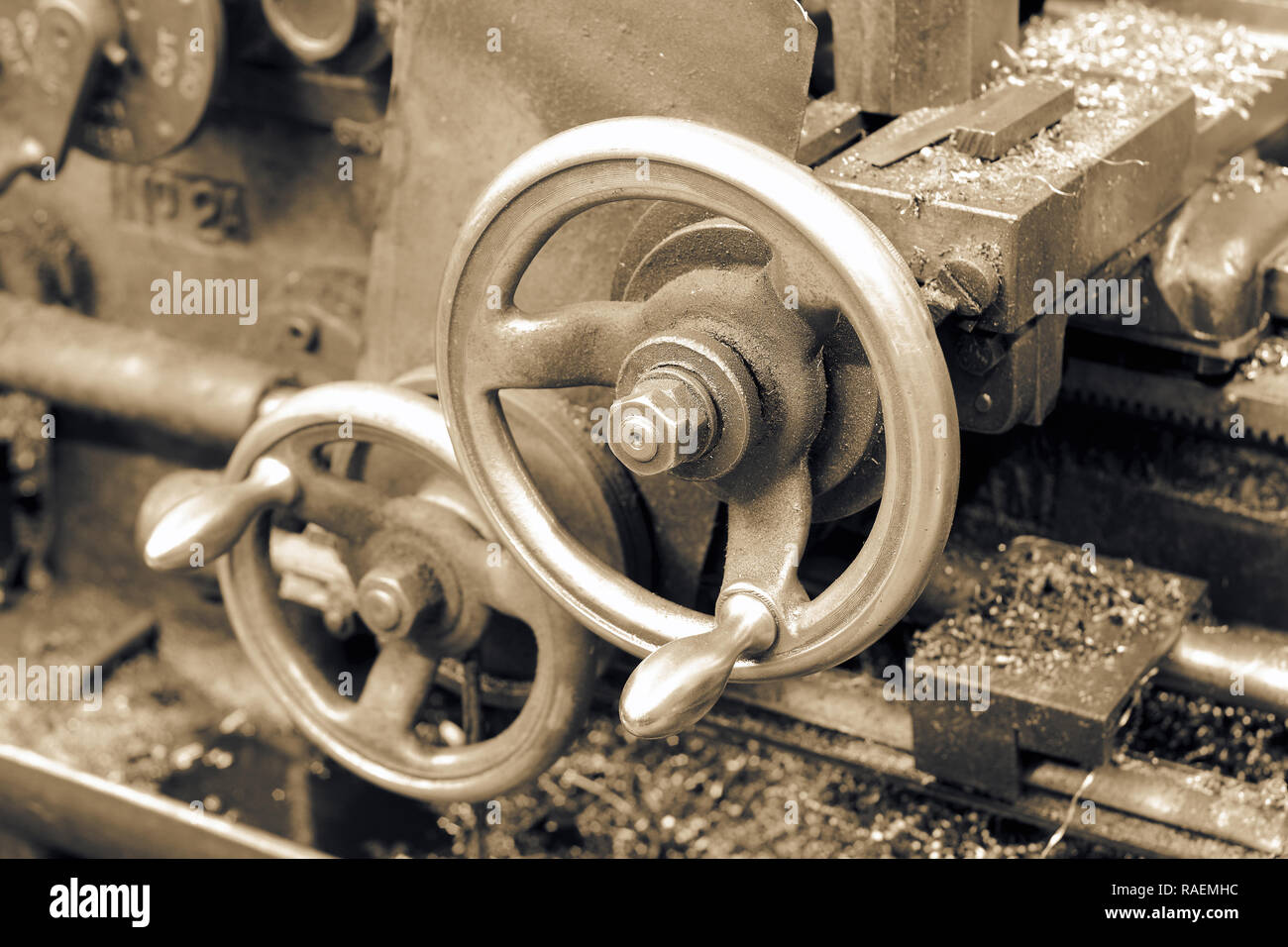 Closeup of the control adjustment wheels on an old industrial lathe