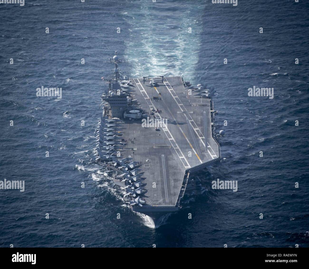 The aircraft carrier USS John C. Stennis (CVN 74) steams through the Arabian Sea, Dec. 14, 2018. The John C. Stennis Carrier Strike Group, Essex Amphibious Ready Group, and 13th Marine Expeditionary Unit are conducting integrated operations in the Arabian Sea to ensure stability and security in the Central Region, connecting the Mediterranean and the Pacific through the western Indian Ocean and three strategic choke points. Stock Photo