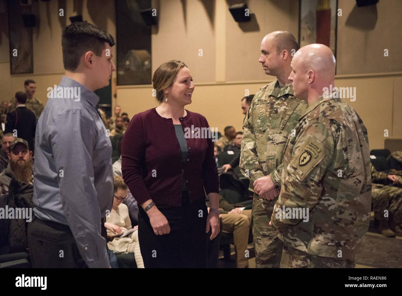 Staff. Sgt. Gallegos's son MacAiden and his mother Amanda, speak to U.S Army Col. Jason J. Jones, commander of the 4th Infantry Brigade Combat Team (Airborne), 25th Infantry Division, U.S. Army Alaska and Command Sgt. Maj. Joseph J. Hissong, senior enlisted advisor for the 1st Battalion, 501st Parachute Infantry Regiment, 4-25 IBCT(A), USARAK, following Gallegos’s Distinguished Service Cross ceremony at Joint Base Elmendorf-Richardson, Alaska Dec. 15, 2018. Gallegos was posthumously awarded the nation’s second highest honor for valor for actions during the battle of Kamdesh in Afghanistan Oct. Stock Photo