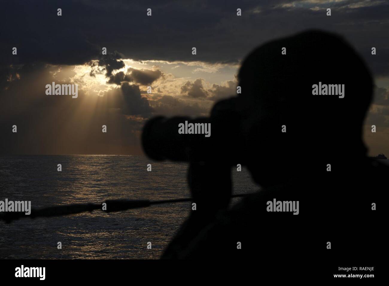 GULF OF OMAN (Dec. 15, 2018) U.S. Army Specialist David Resnick, a Combat Cameraman, takes photographs aboard the Cyclone-class coastal patrol ship USS Thunderbolt (PC 12). Thunderbolt is deployed to the U.S. 5th Fleet area of operations in support of naval operations to ensure maritime stability and security in the Central Region, connecting the Mediterranean and the Pacific through the western Indian Ocean and three strategic choke points. Stock Photo