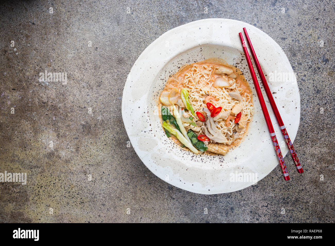 japanese ramen noodle with chicken, shiitake mushroms and egg in white