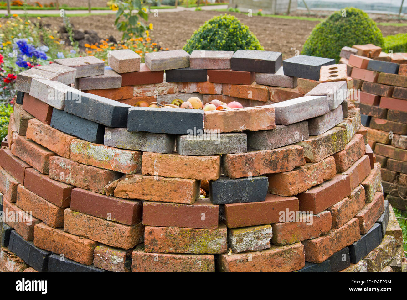 Makeshift brick built compost bin Stock Photo