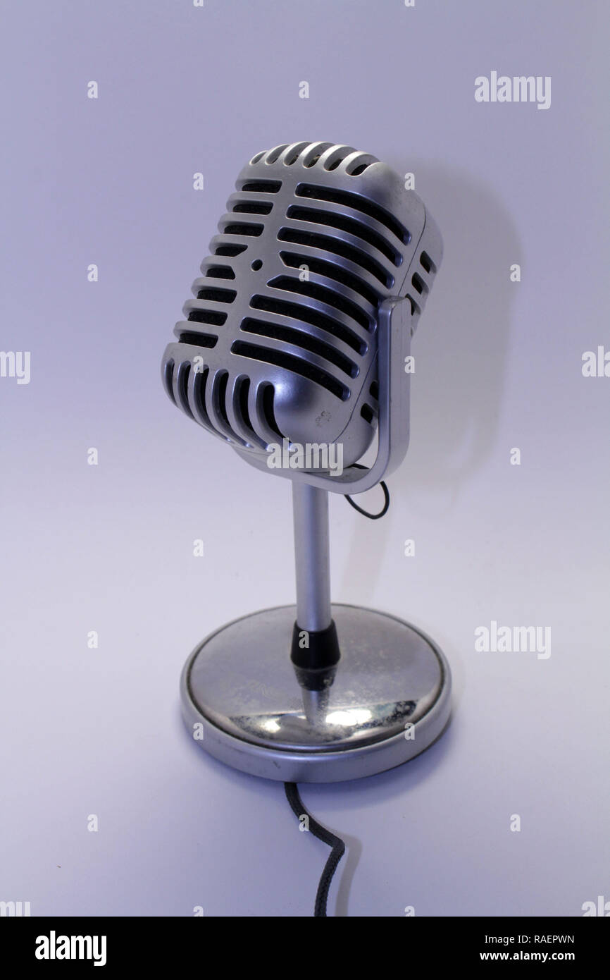A mic, mike, or microphone with its cable. Taken with white background