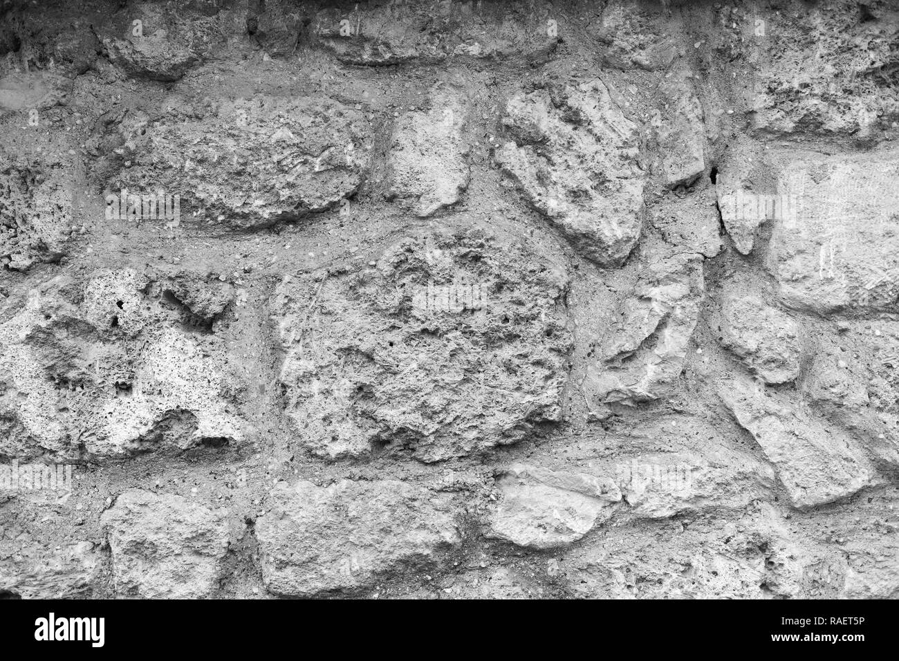 Old grunge stone background. Horizontal black and white color photography. Stock Photo