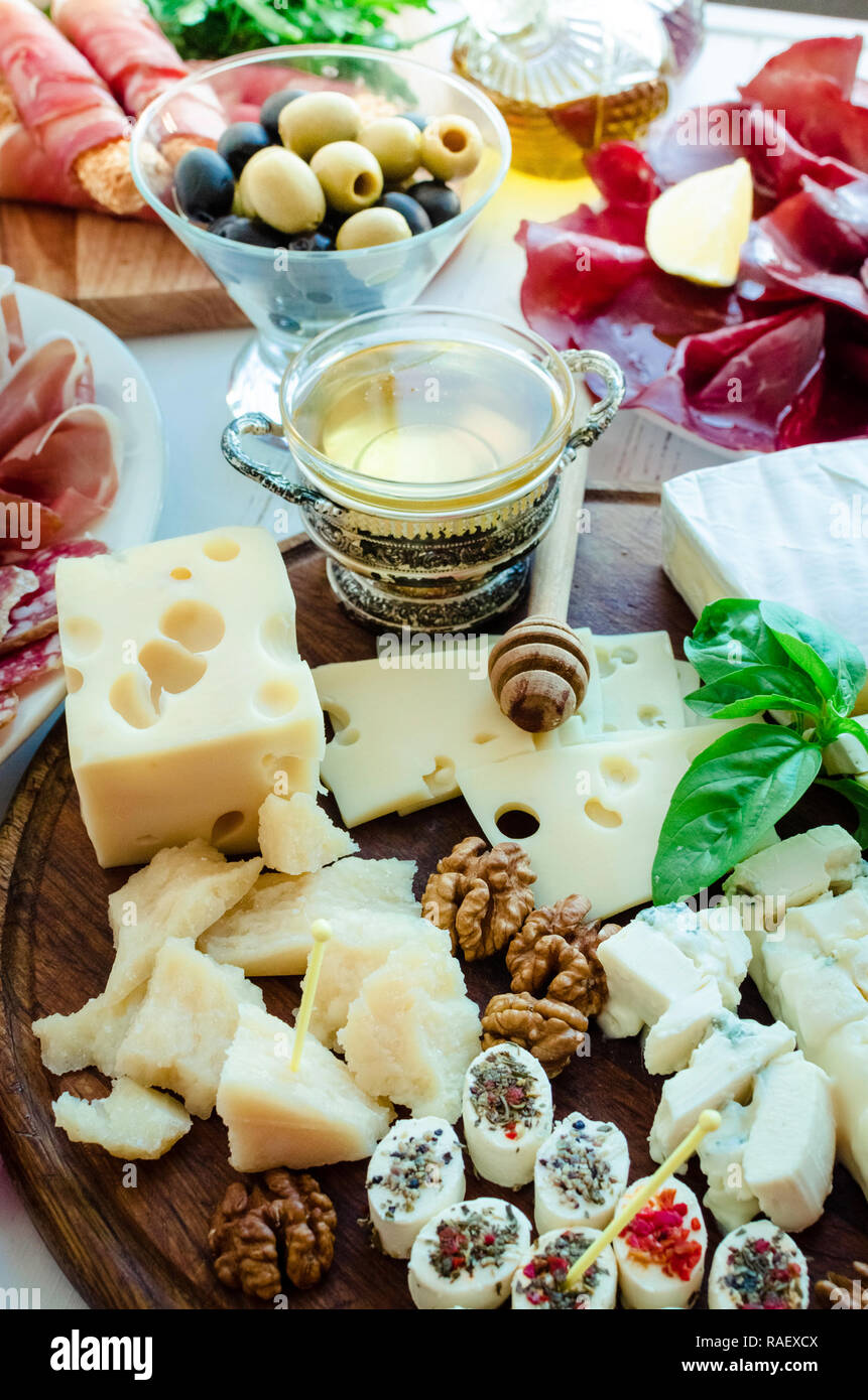Table full of mediterranean appetizers, tapas or antipasto. Assorted ...