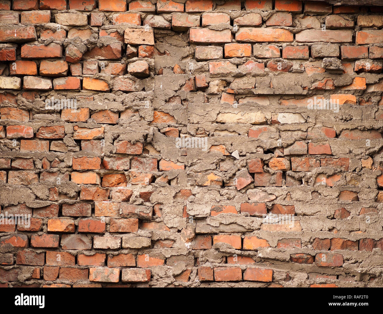 The broken wall. An external broken wall of an old and abandoned factory. Stock Photo