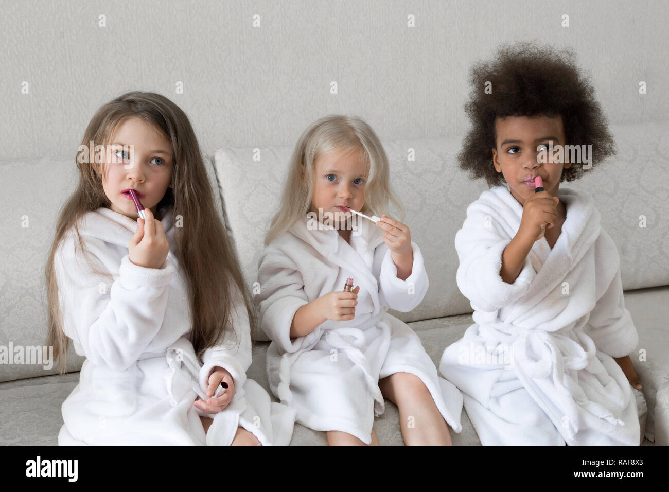 little girls playing with makeup
