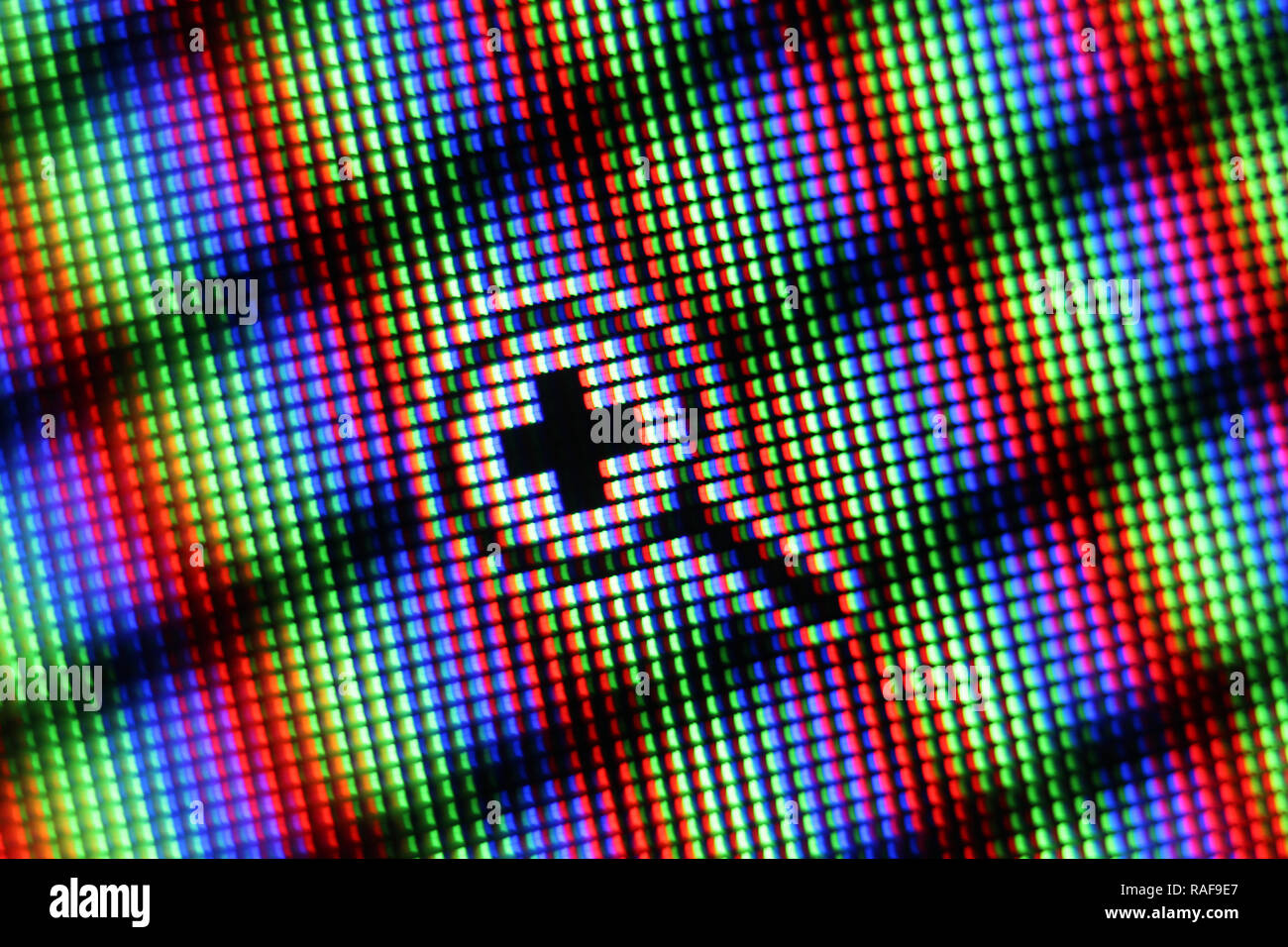 Magnifying glass icon on screen, close-up Stock Photo