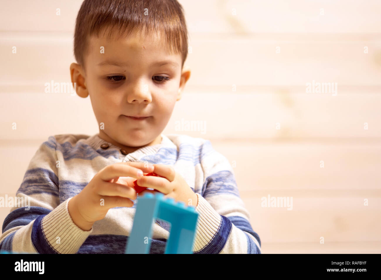 little boy plays with toy car at home Stock Photo - Alamy