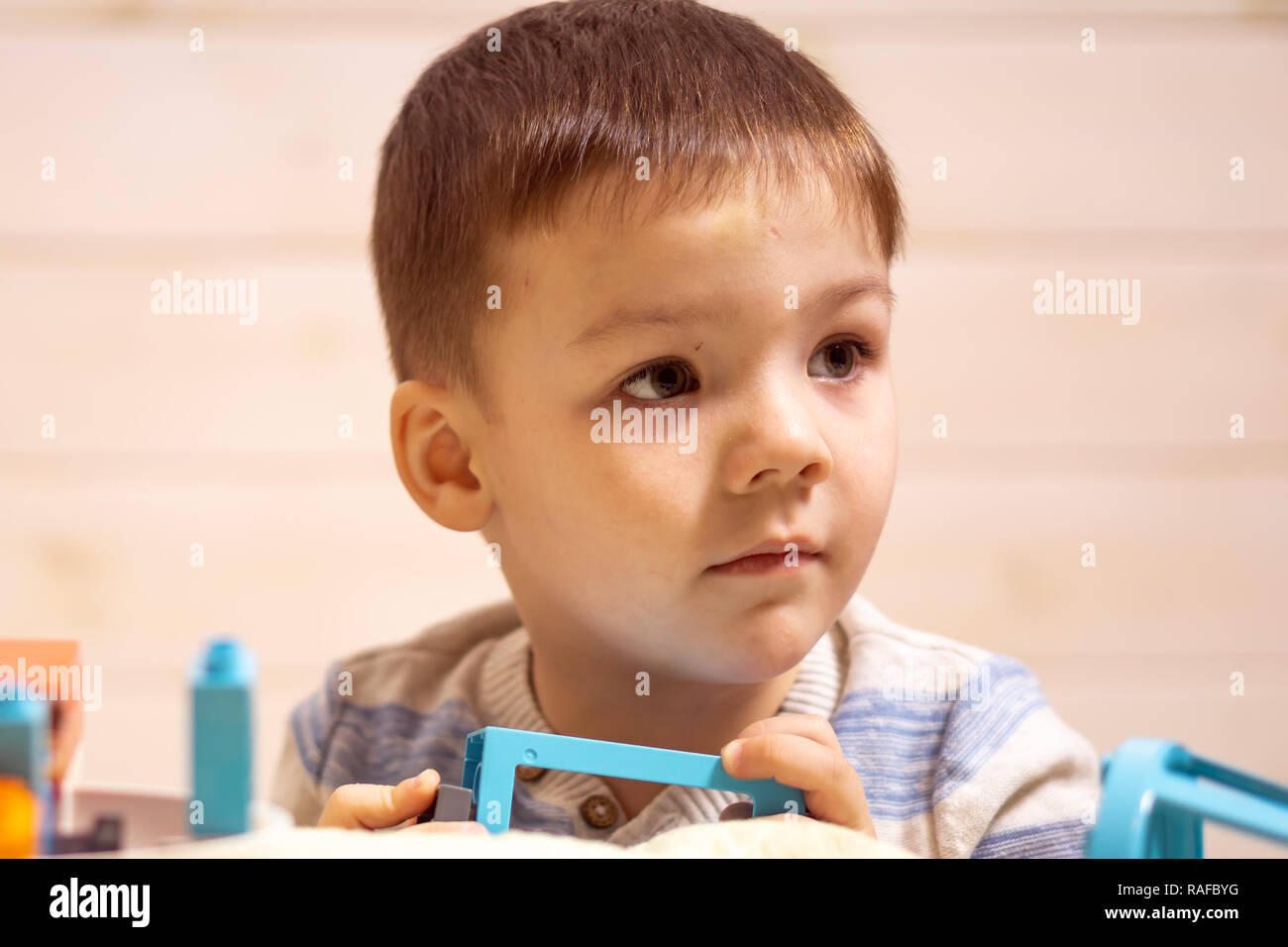 little boy plays with toy car at home Stock Photo - Alamy
