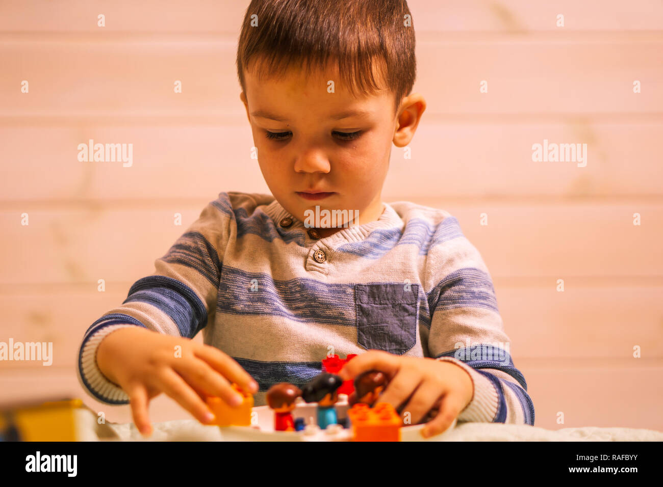 little boy plays with toy car at home Stock Photo - Alamy
