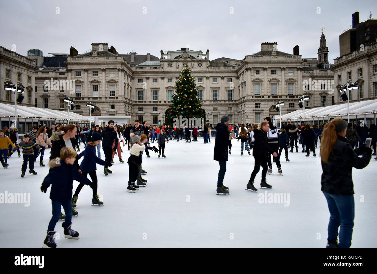 People skating on ice at the Somerset House Christmas Ice Rink. London ...