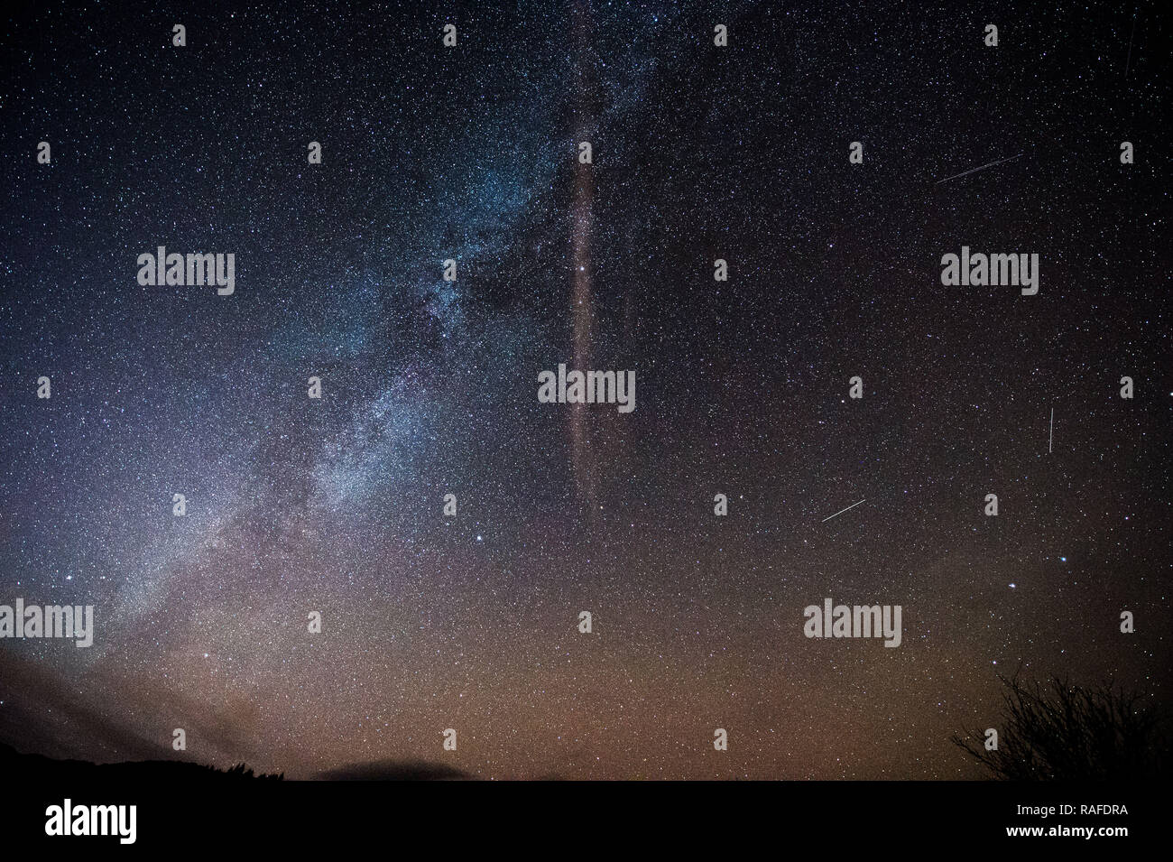 Milky Way, stars and night sky as seen from the outstanding beautiful area of The Trossachs in Scotland, Stirling, UK - 1st January 2019. Stock Photo