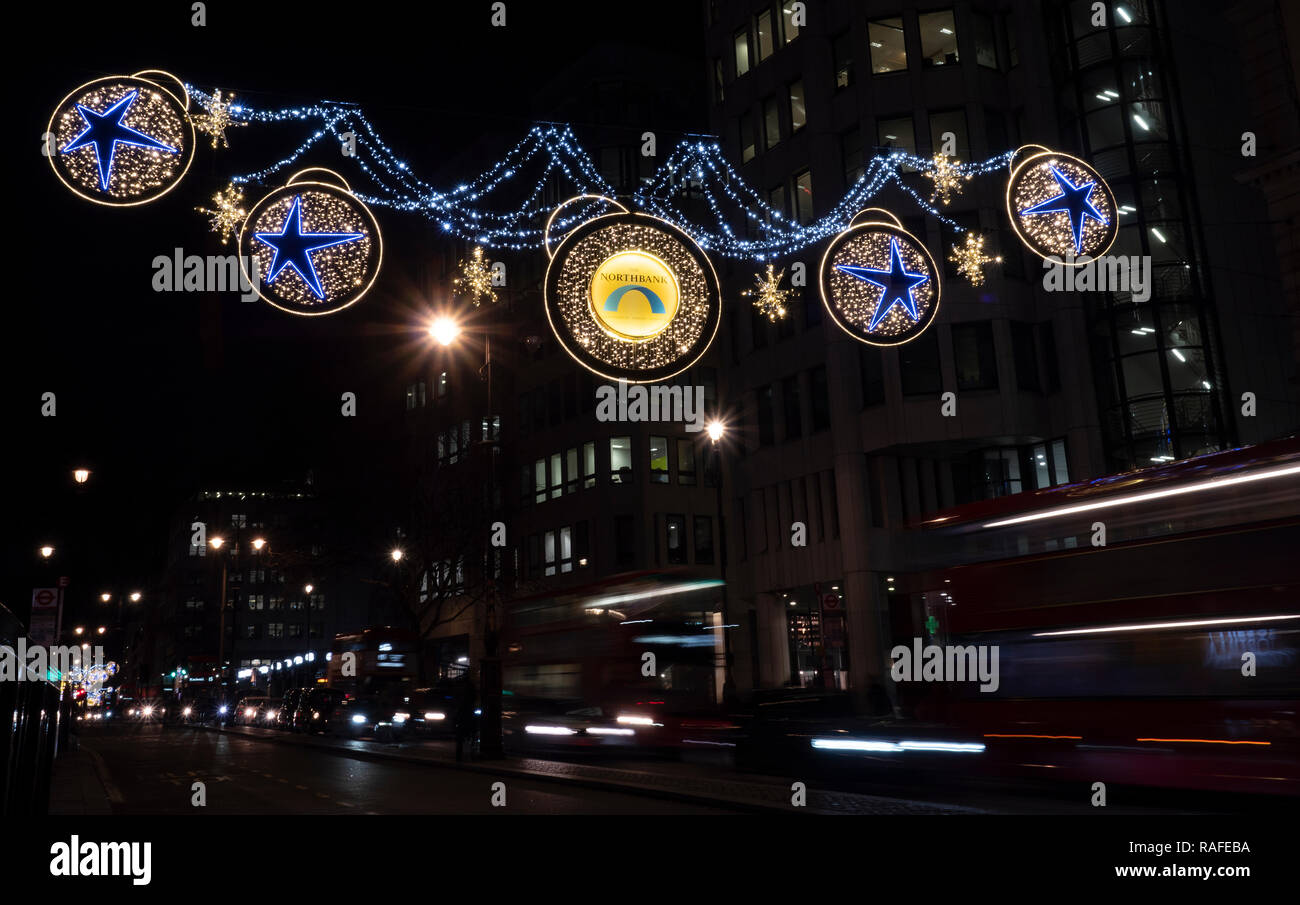 Christmas street decorations, The Strand, Central London, England, UK. Stock Photo