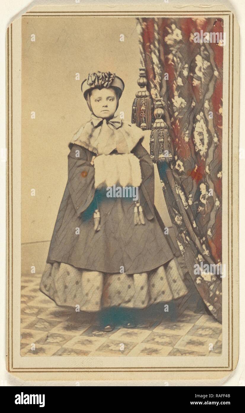 little girl dressed in winter clothing with hand muff, standing, Emery