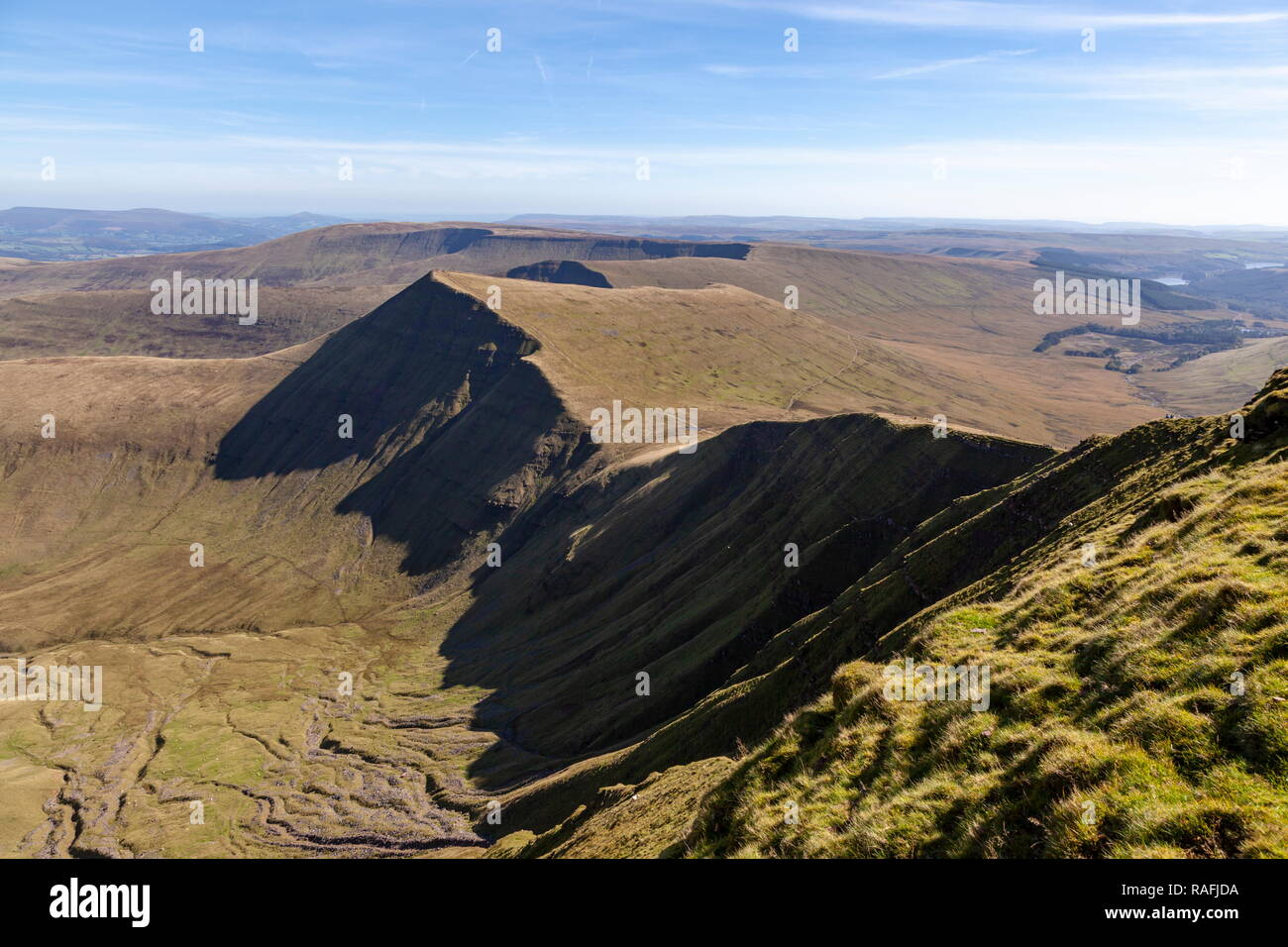 A view from the summit of Pen Y Fan along the ridge towards the summit of Cribyn, Brecon Beacons National Park Stock Photo