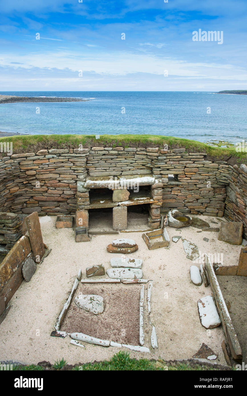 Remains of one of the homes at Skara Brae, a stone-built Neolithic village on the west coast of the Orkney Islands in Scotland Stock Photo