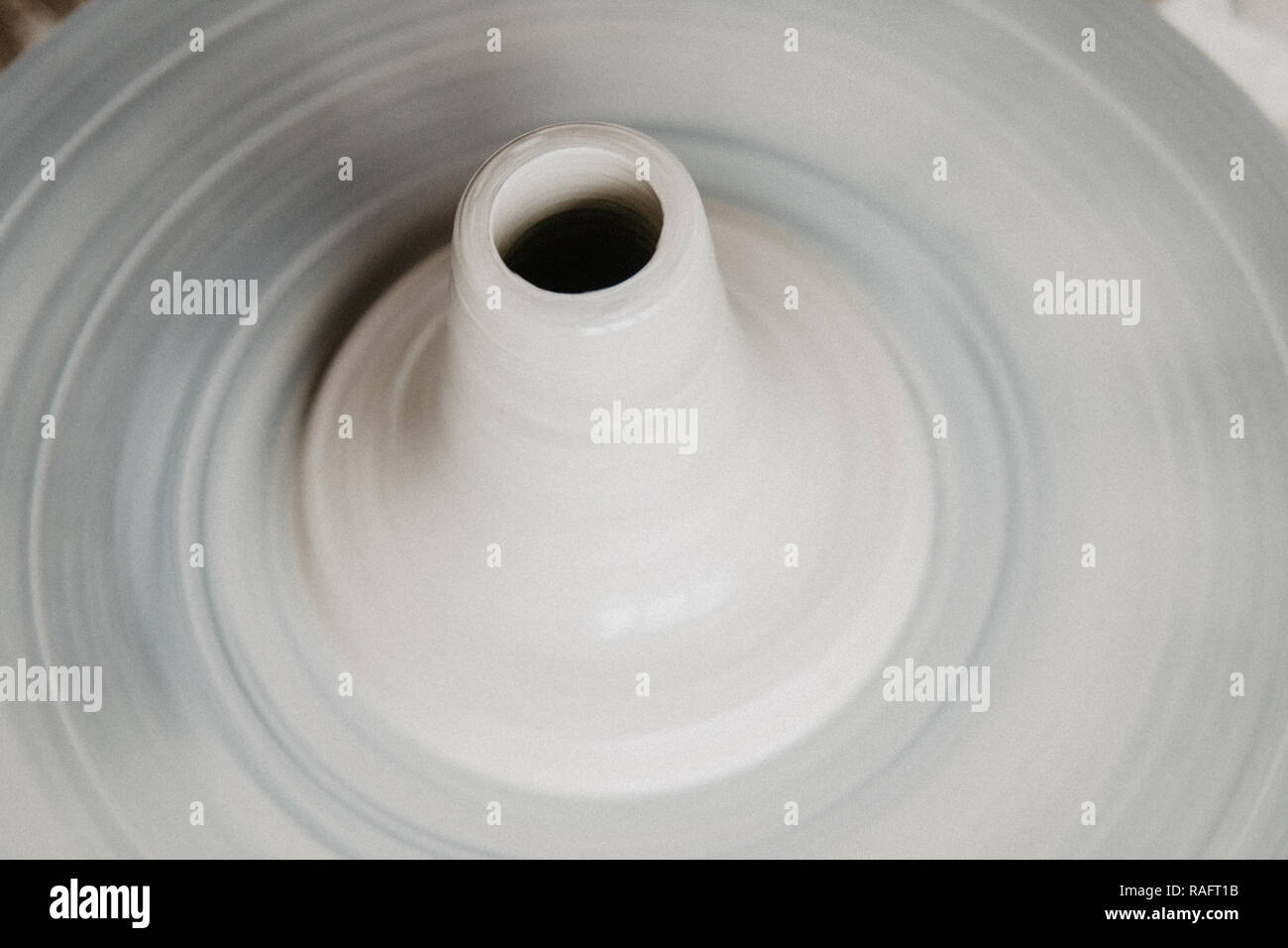 Top view of clay products, on a pottery wheel with copy space, closeup Stock Photo