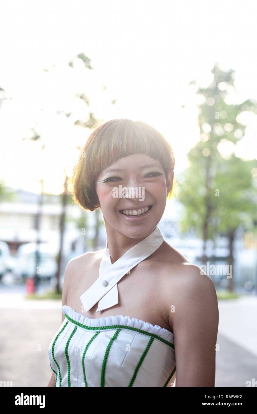 Asian Female Model Poses For Pictures At The Hair Cut Stock Photo