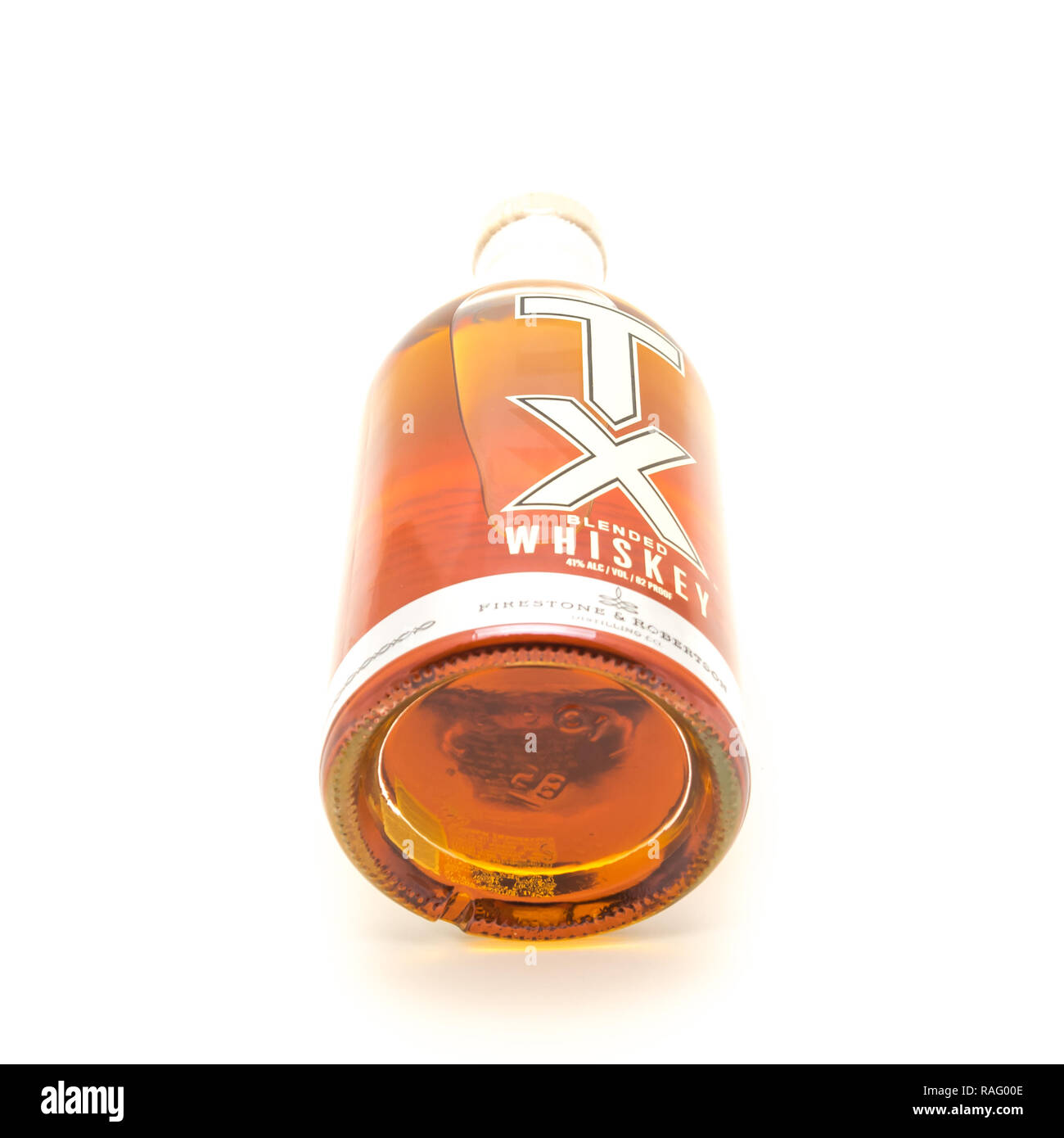 Lying bottle of TX Blended Whiskey isolated on white from Firest Stock
