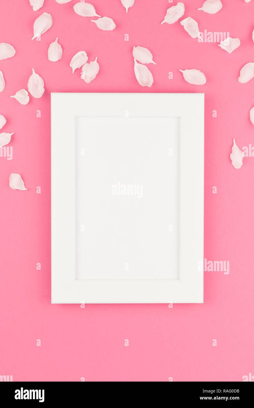 Creative flat lay concept top view of white frame mock up and apple ...