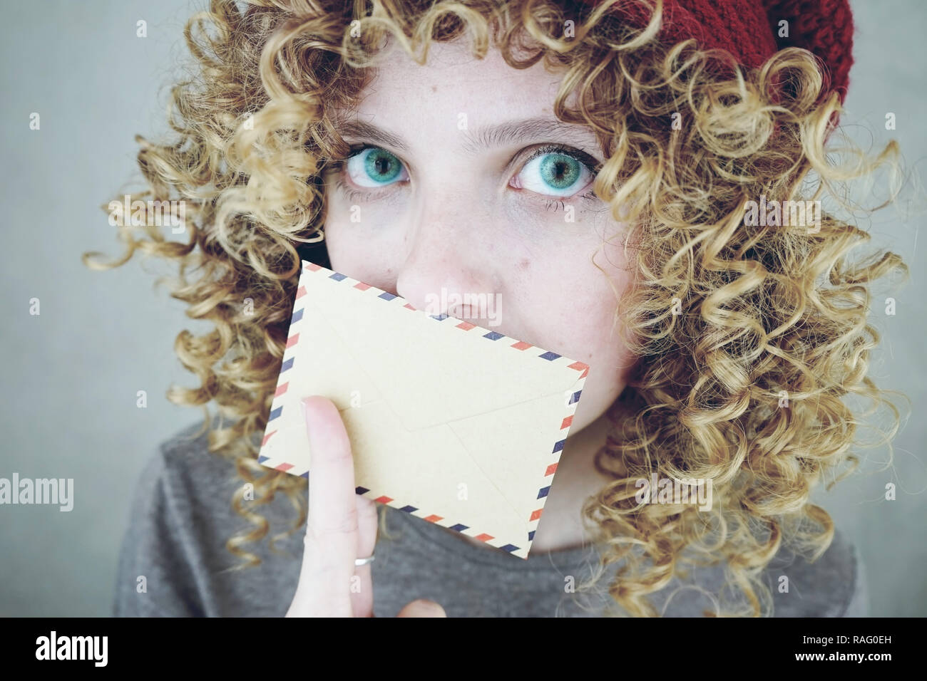 Close Up Portrait Of A Beautiful And Young Funny Woman With Blue