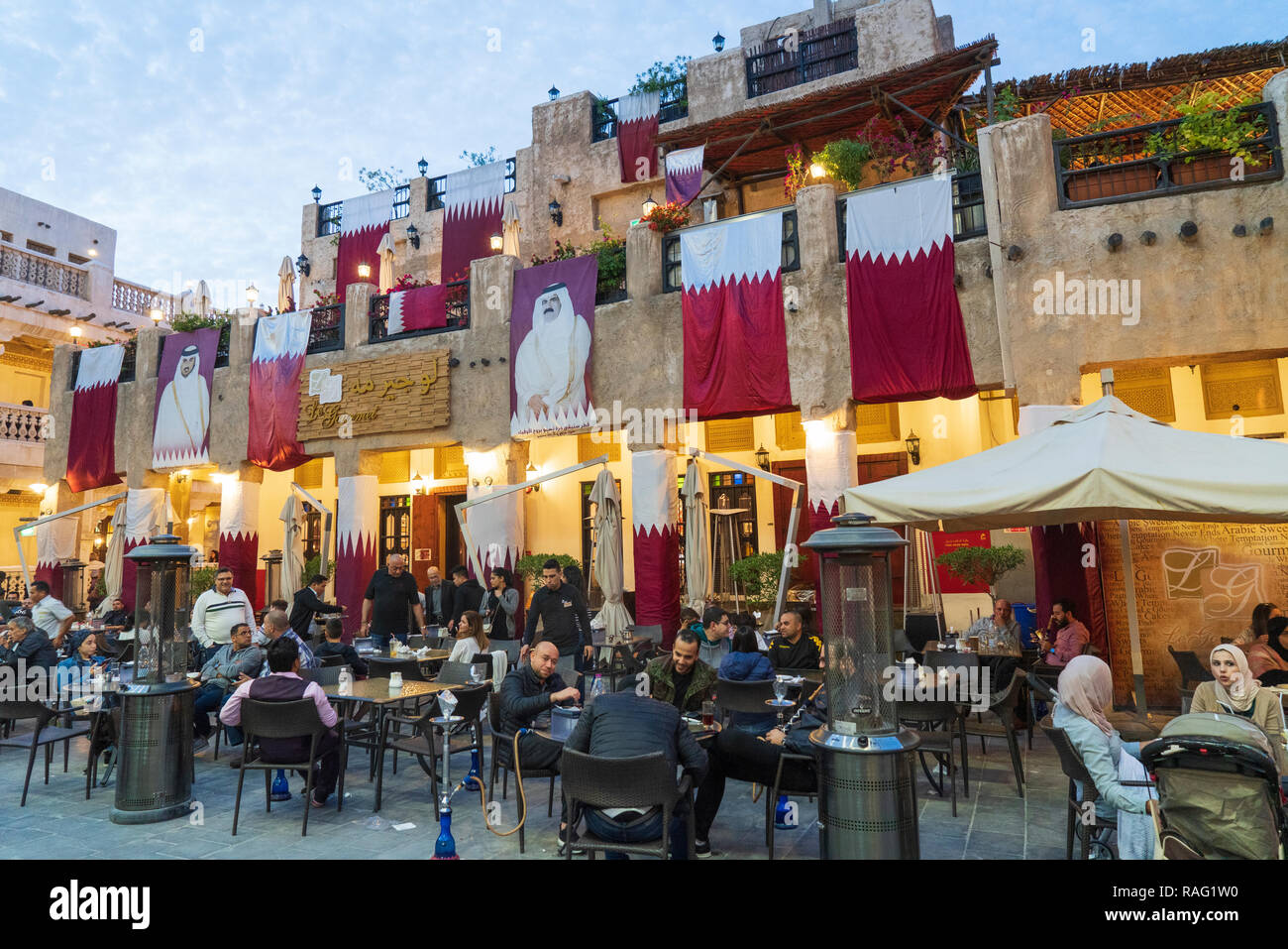 Busy restaurant in the evening at Souq Waqif in Doha, Qatar Stock Photo