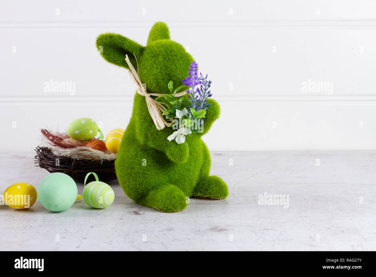 Easter scene with colored eggs in nest and green fresh bunny Stock ...