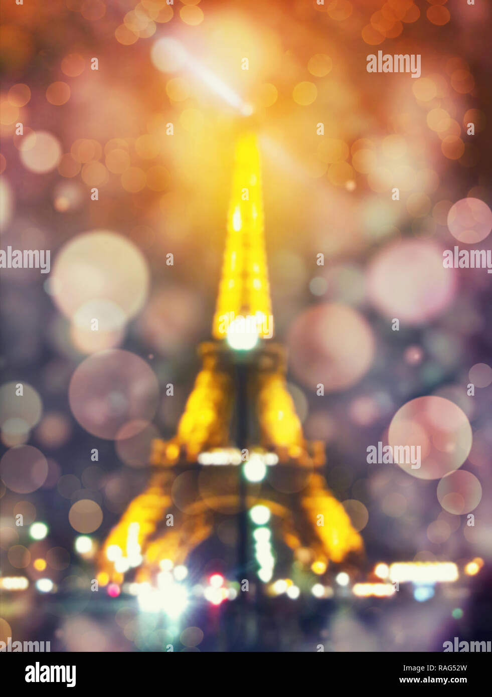 Blurred defocused night scene and Eiffel Tower silhouette shining in Paris with defocus bokeh and colorful lights. Romantic symbol background shot mad Stock Photo