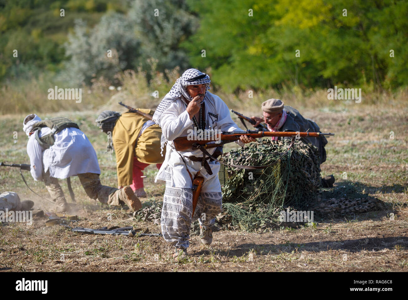 Historical festival Sambek Heights. Mujahideen retiring pell-mell from battlefield Stock Photo