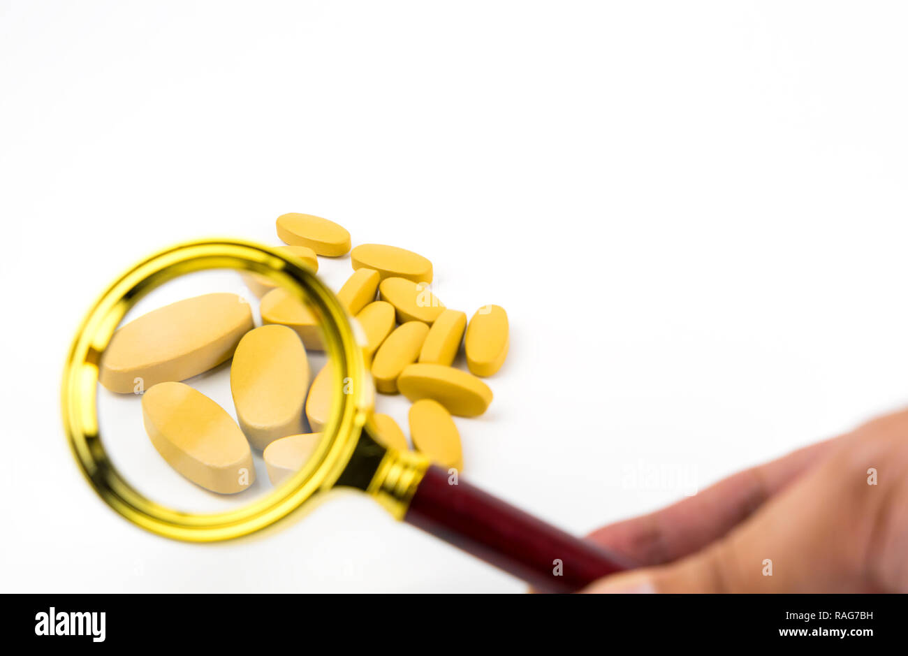 Magnifying drug tablets for quality check Stock Photo Alamy
