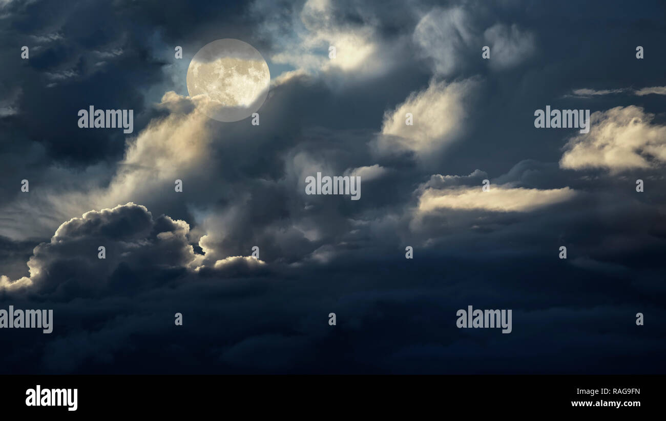 Cloudy full moon night sky Stock Photo - Alamy