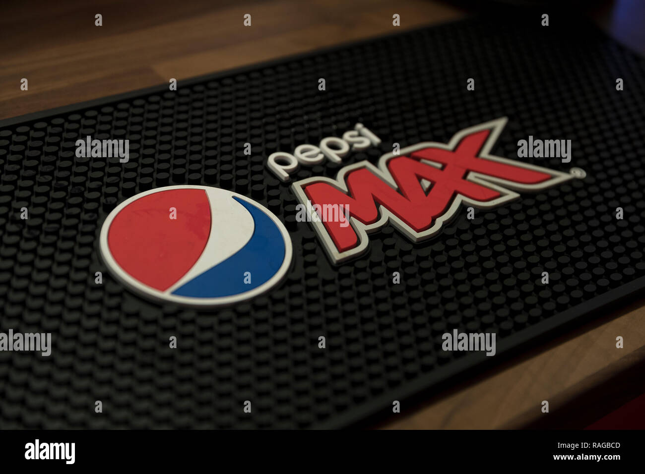 London, United Kingdom - December 30th 2018: Pepsi Max rubber drink mat on the wooden surface at the bar Stock Photo